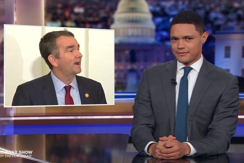 Trevor Noah in front of a photo of Ralph Northam.